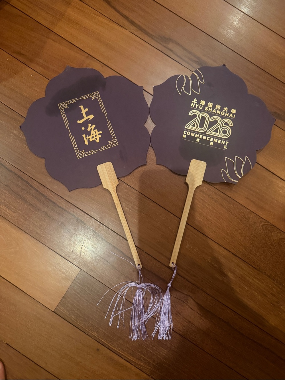 Rare pair of NYU 2026 Shanghai Purple Commencement Fans set with tassels